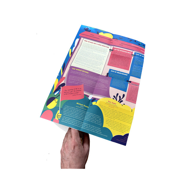 Photo showing a hand holding open the folded Mapology Guide “The Expedition Towards a Meaningful Life,” revealing colourful illustrated sections and text exploring purpose, perseverance, and new life directions.