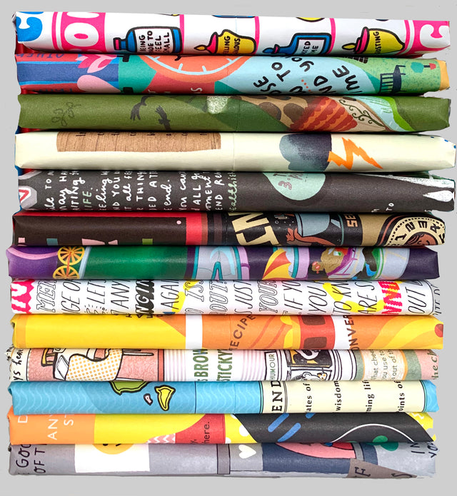 A pile of thin packages wrapped in colourful illustrated papers